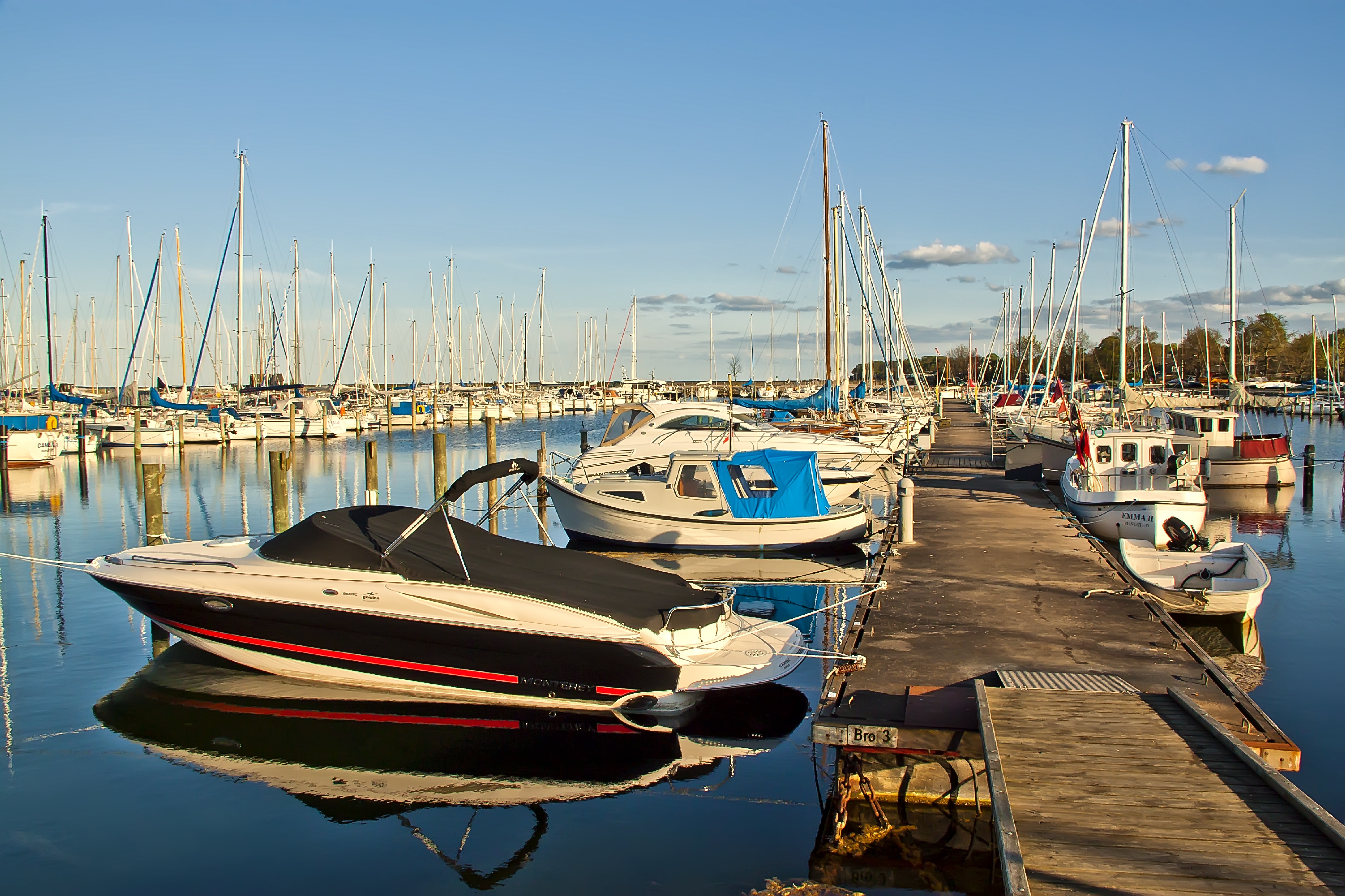 Rows of boats docked closely together in a marina